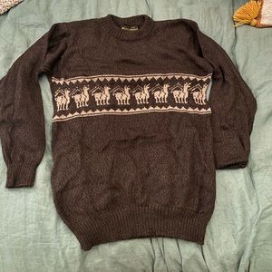 Genuine adult alpaca sweater. Dark brown with alpaca design on the front. Size M